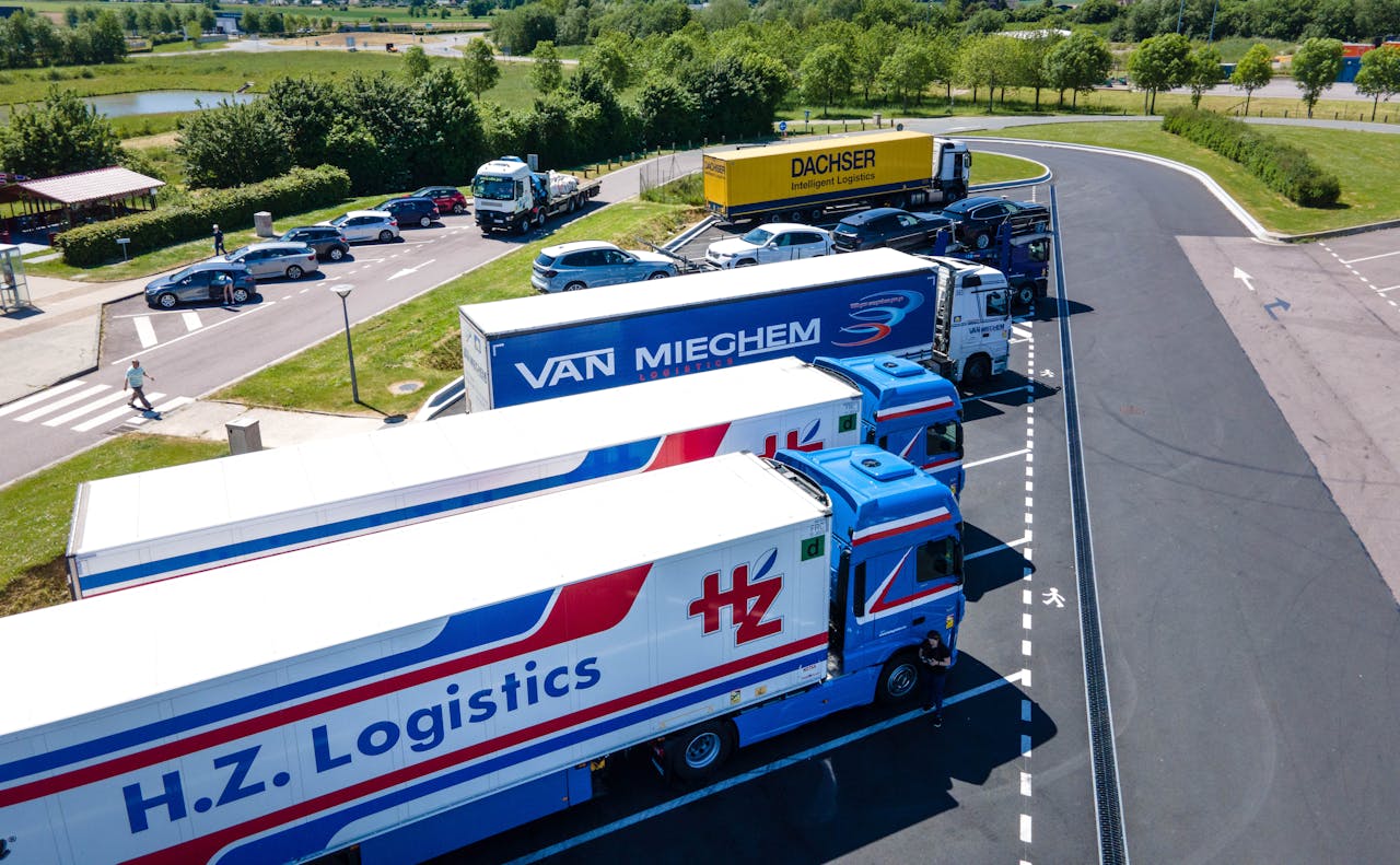 digital Aerial image showcasing logistics trucks parked in a rest area.
