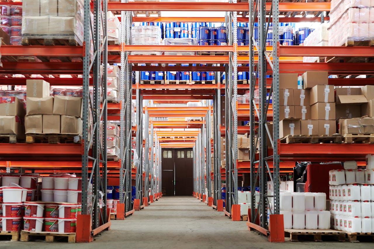 creative Wide angle view of a warehouse with stocked shelves and boxes.